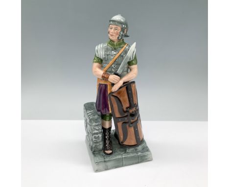 Finely detailed soldier dressed in Roman armor, complete with a helmet, sword, and shield. The piece depicts the centurion st