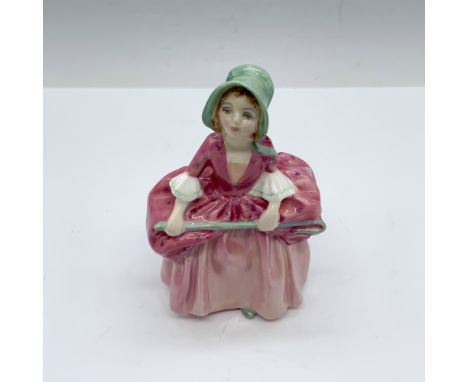 This figure looks adorable in her soft pink dress that is delicately detailed with small flowers a white ruffled at the cuff 