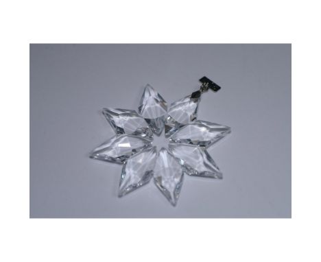 Add a touch of timeless elegance to your holiday décor with this Swarovski Crystal 2013 Christmas Ornament. This exquisite, f