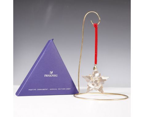 The Swarovski 2021 Annual Edition Ornament is a beautifully crafted crystal snowflake with intricate facets that reflect ligh