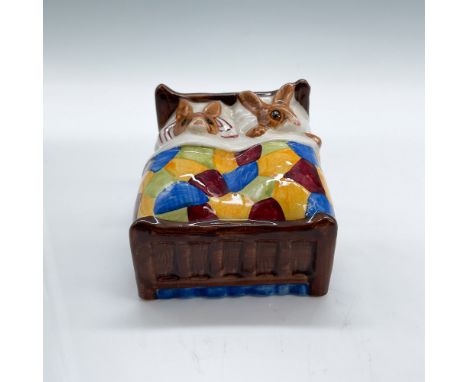 Royal Doulton Bunnykins figurine titled "Sleepytime," model DB15, depicting two bunnies snuggled in bed under a colorful patc