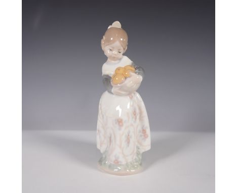 A charming Lladro porcelain figurine titled Girl from Valencia, model number 01004841. This delicate sculpture depicts a youn