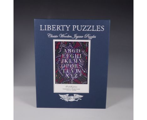 A finely crafted wooden jigsaw puzzle by Liberty Puzzles, featuring the Typographer's design by Mark Graham. This intricate p
