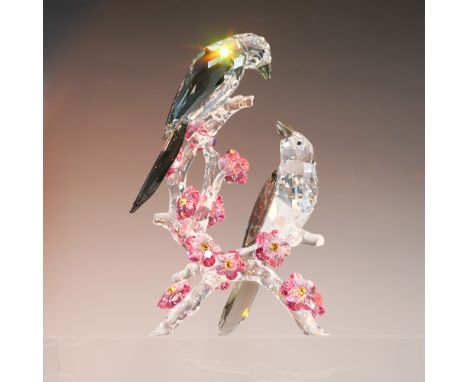 Swarovski crystal figurine featuring an Asian-inspired design with symbolic meaning, representing double happiness. This piec