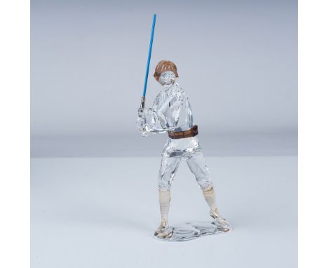 Presenting a meticulously crafted Swarovski crystal figurine depicting the iconic Star Wars hero, Luke Skywalker. This piece 