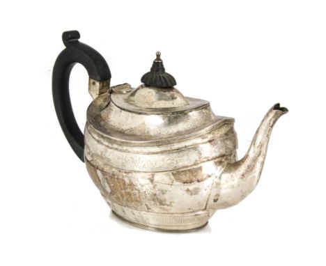 An Edwardian silver teapot, possibly by GM, oval with engraving and applied black handle and finial, 13.8 ozt 