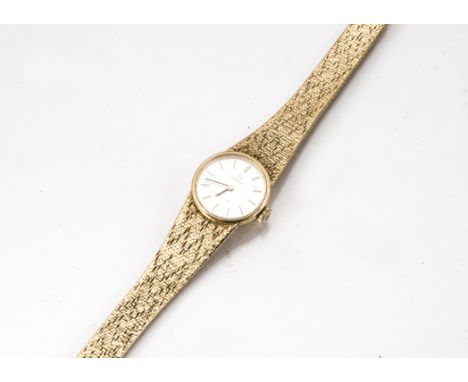 A c1980s Omega De Ville manual wind 9ct gold lady's wristwatch, 20mm case, on integrated 9ct gold Omega strap, 31g, appears t
