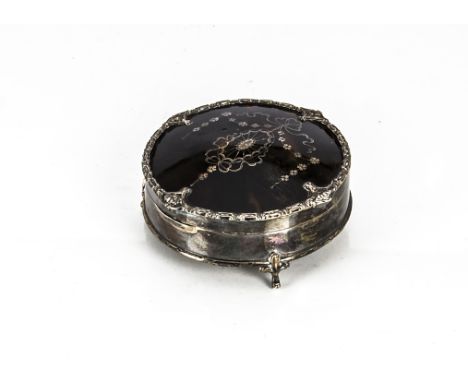 An early 20th century silver and tortoiseshell circular trinket box from Mappin &amp; Webb, with pique inlaid cover, on three