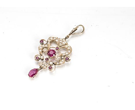 A yellow metal seed pearl and synthetic ruby Art Nouveau style pendant,  6cm x 3cm, 5.3g 