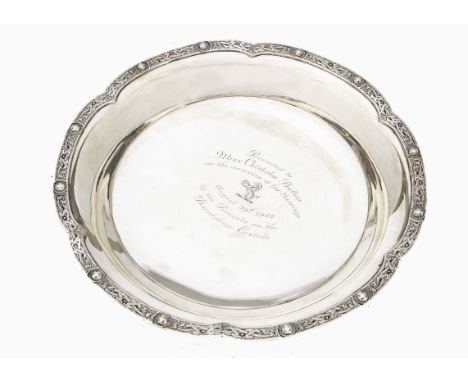 An Art Deco period silver presentation dish by W&amp;W, having shaped rim with Celtic band, well with inscription for Miss Ch