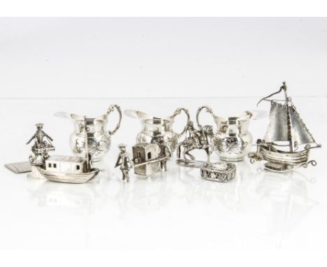 A group of ten small collectable silver and white metal items, including a set of three dolls' house style jugs, marked 800, 