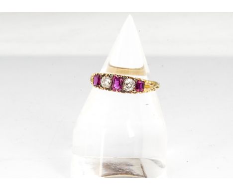 A Victorian 18ct gold ruby and diamond five stone ring, the three rectangular cut rubies alternately set with old cut diamond