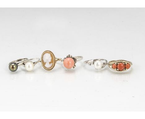 Three pearl set dress rings, together with a silver coral set ring, a gold three stone coral ring, and a 9ct gold oval cameo 