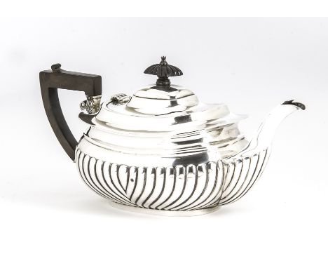 An early George V silver teapot, fluted lower, applied handle and finial, marked Chester 1911, with possibly ALB over FLB, 18