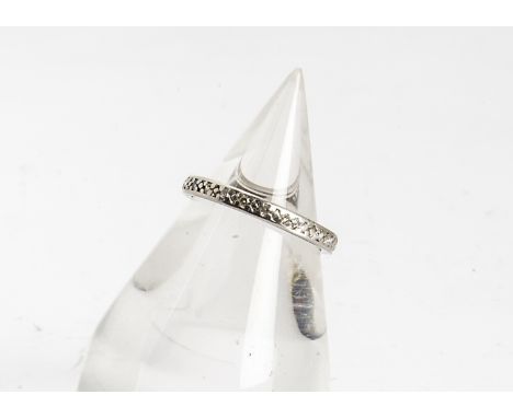 A diamond full eternity ring, the channel set eight cut diamonds in rubbed over settings, ring size M, 2.6g 