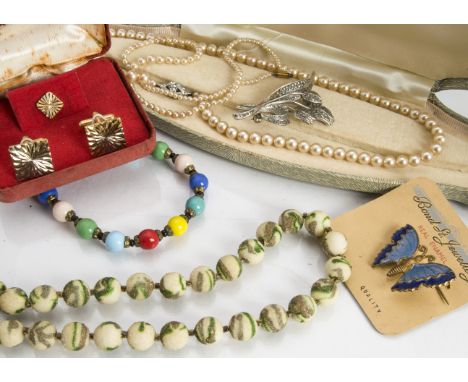 A group of early 20th Century and later costume jewellery, including a Mizpah double heart brooch, an Irish green stone and w