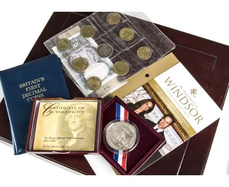 A collection of coins and medallions, including a boxed set of 24 Legendary Aircraft of World War II, a boxed set of gilt and