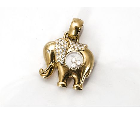 A Chopard elephant diamond set pendant, the diamond encrusted ears and back with pierced circular section with three floating