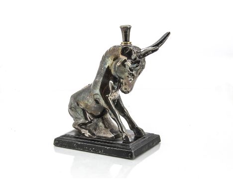 An Art Deco period novelty silver plated table lighter, modelled as a seated ass on black painted base, striker inserted to h