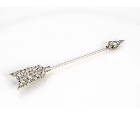 A platinum and diamond gold mounted jabot pin, in the form of an arrow, the encrusted arrow head and feathers with platinum a