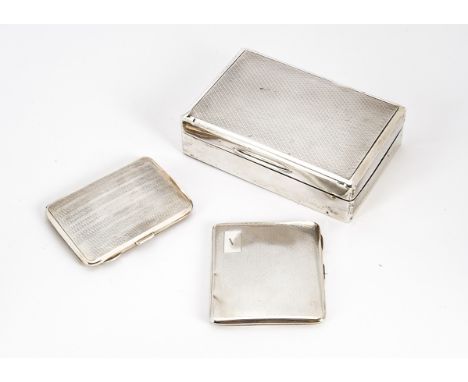 An Art Deco period silver cigarette box, together with two similar period silver cigarette cases (3) 