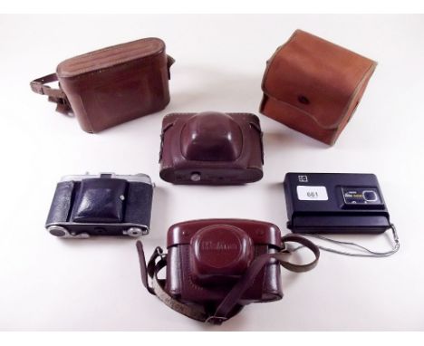 A group of vintage cameras 
