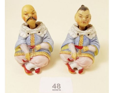 A pair of bisque continental figures of Chinese man and woman seated 