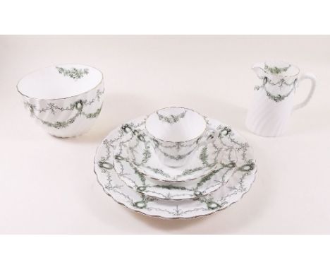 An Edwardian Aynsley tea service decorated green swags comprising: ten cups and saucers, jug and sugar, twelve tea plates and