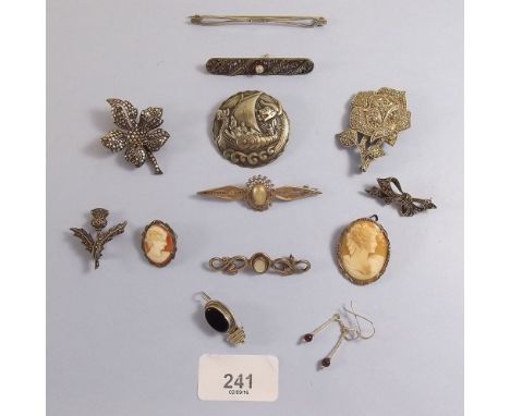 An 830 silver Viking brooch and various silver marcasite brooches etc.