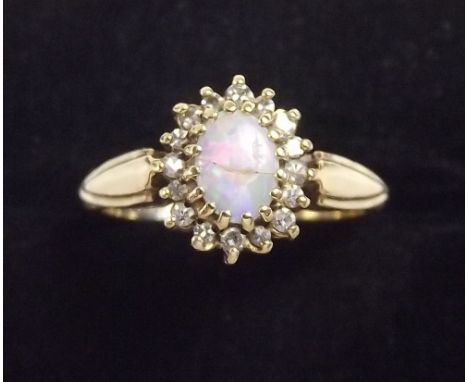 A 9 carat gold opal and diamond ring 