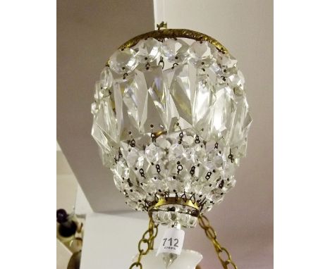 A small basket form chandelier light fitting 