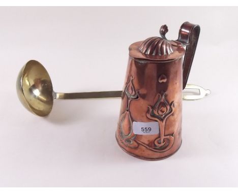 An Art Nouveau copper jug by J S Sankey & Son and a large brass ladle 