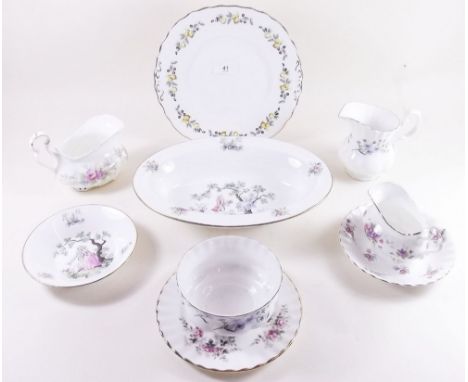 A Richmond tea service printed forget me nots comprising: five cups and saucers, six tea plates, cake plate, jug and milk and