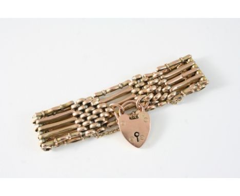 A 9CT. GOLD GATE LINK BRACELET with padlock clasp, 23 grams.