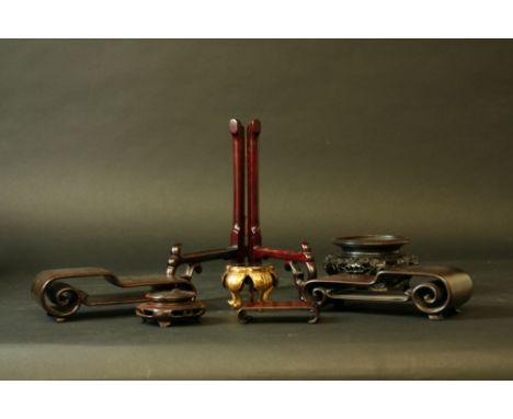A GROUP OF WOOD STANDS largely for small Chinese objects and plates (approx 40)