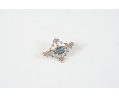 AN AQUAMARINE AND DIAMOND BROOCH centred with an octagonal-shaped aquamarine within a foliate surround set with rose-cut diam