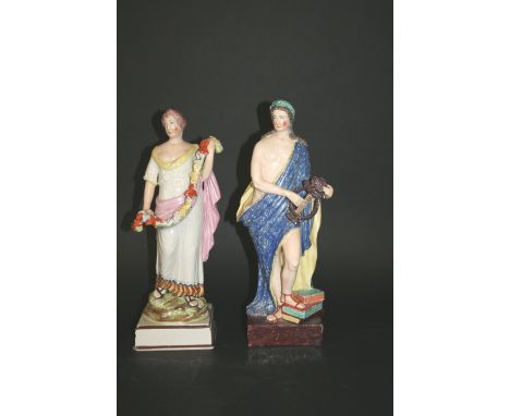 TWO EARLY 19THC PEARLWARE FIGURES one of Apollo playing a lyre, the other of Flora holding a garland of flowers. Both in colo