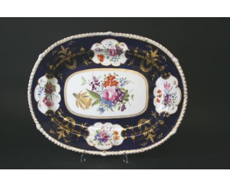 DERBY PART DINNER SERVICE each piece painted with panels of flowers on a dark blue ground, and rich gilded decoration. Compri