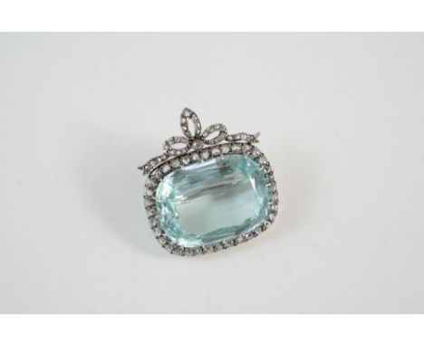 A BELLE EPOQUE AQUAMARINE AND DIAMOND BROOCH the oval shaped aquamarine is set within a surround of rose-cut diamonds, with d