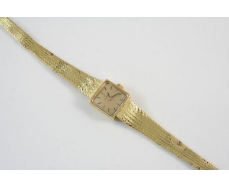 A LADY'S 18CT. GOLD WRISTWATCH BY OMEGA the signed square-shaped dial with baton numerals, on an 18ct. gold integrated bracel