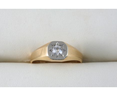 A DIAMOND SOLITAIRE RING set with a circular-cut diamond in 18ct. gold and platinum. Size P.