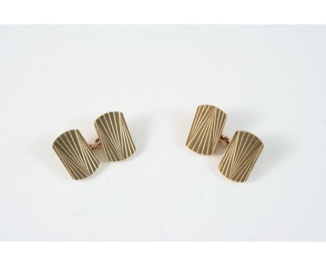 A PAIR OF 9CT. GOLD CUFFLINKS of rounded rectangular-shape, with engine turned decoration, 15 grams.