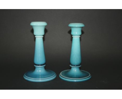 PAIR OF AULT CANDLESTICKS - DRESSER a pair of pottery candlesticks in a turquoise glaze, with slightly differing bases. Impre