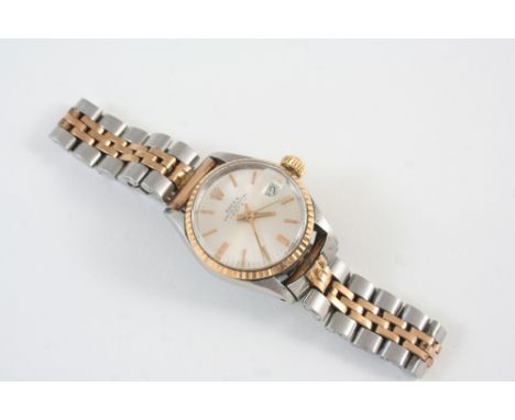 A LADY'S STAINLESS STEEL AND GOLD OYSTER PERPETUAL DATE WRISTWATCH BY ROLEX the signed circular dial with baton numerals, on 