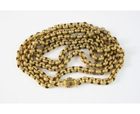 A GEORGIAN PINCHBECK LONG GUARD CHAIN formed with circular granulated links set to a tubular clasp, set with small garnets, 1