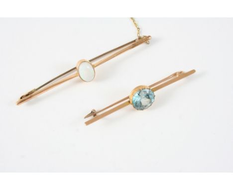 A GOLD AND OPAL BAR BROOCH set with an oval cabochon opal, 7cm. long, together with a gold and zircon bar brooch, 5.5cm. long