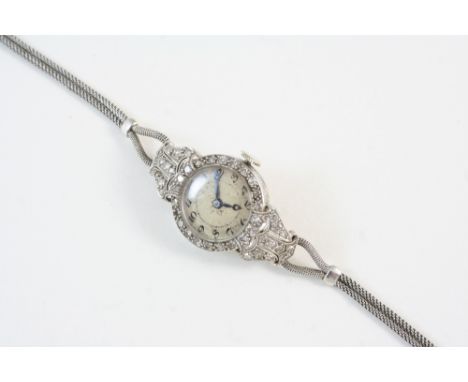 A LADY'S DIAMOND COCKTAIL WRISTWATCH the circular dial with Arabic numerals, with circular-cut diamonds millegrain set to the