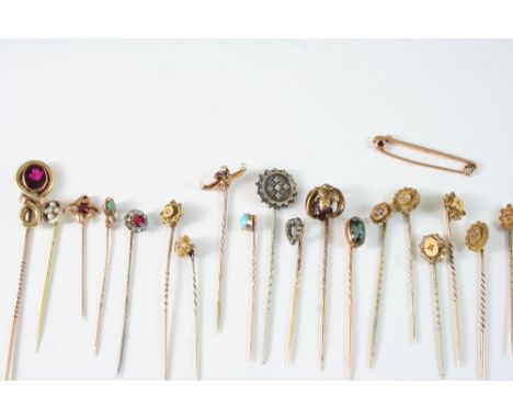 A DIAMOND, SAPPHIRE AND RUBY STICK PIN set in gold with two small pearls, a diamond, pearl and gold stick pin, an amethyst an