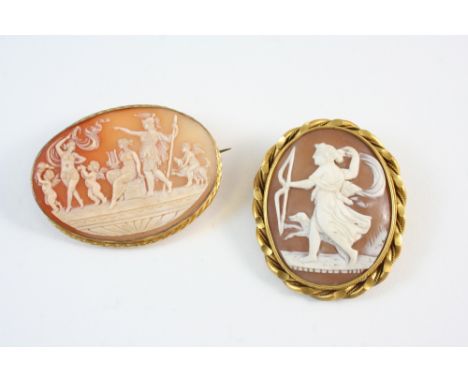 AN OVAL CARVED SHELL CAMEO BROOCH possibly depicting Artemis, the goddess of Hunting, 5 x 5cm., together with another oval ca