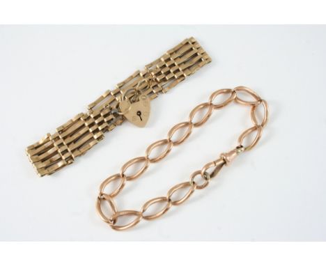 A 9CT. GOLD GATE LINK BRACELET with padlock clasp, 12 grams, together with a 9ct. gold oval link bracelet, 18 grams.